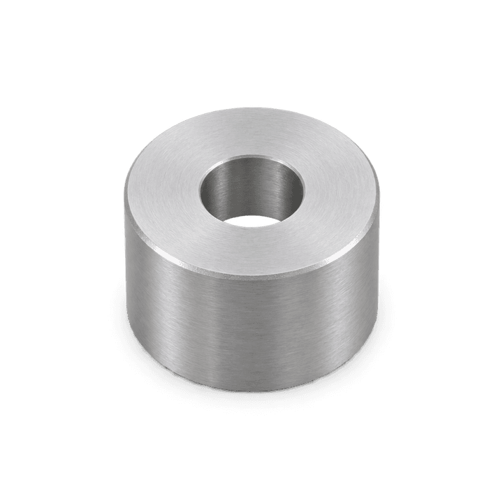 A short grey cylindrical spacer with a hole through its axis